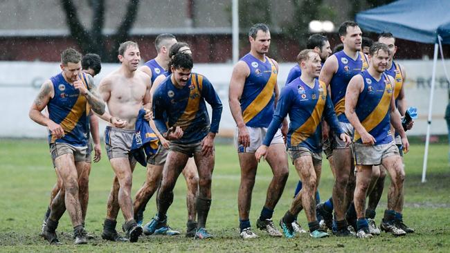 As Mitcham’s players know, it’s much more enjoyable playing in the wet when you win. Picture: AAP/Morgan Sette