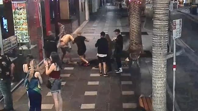 The group continued to fight even after the 29-year-old was knocked out. Picture: 9 News