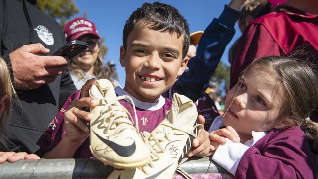 Jensen Spaul and Indigo Spaul with Jensen's Boots signed by Kurt Capewell at Queensland Maroons fan day at Toowoomba Sports Ground, Tuesday, June 18, 2024. Picture: Kevin Farmer