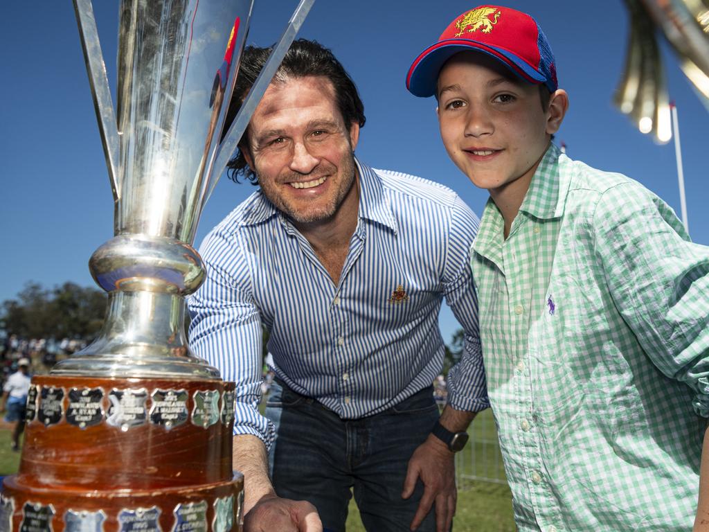 Downlands First XV 1999 winning team captain Gene Fairbanks shows his son Digby Fairbanks the O'Callaghan Cup. Picture: Kevin Farmer