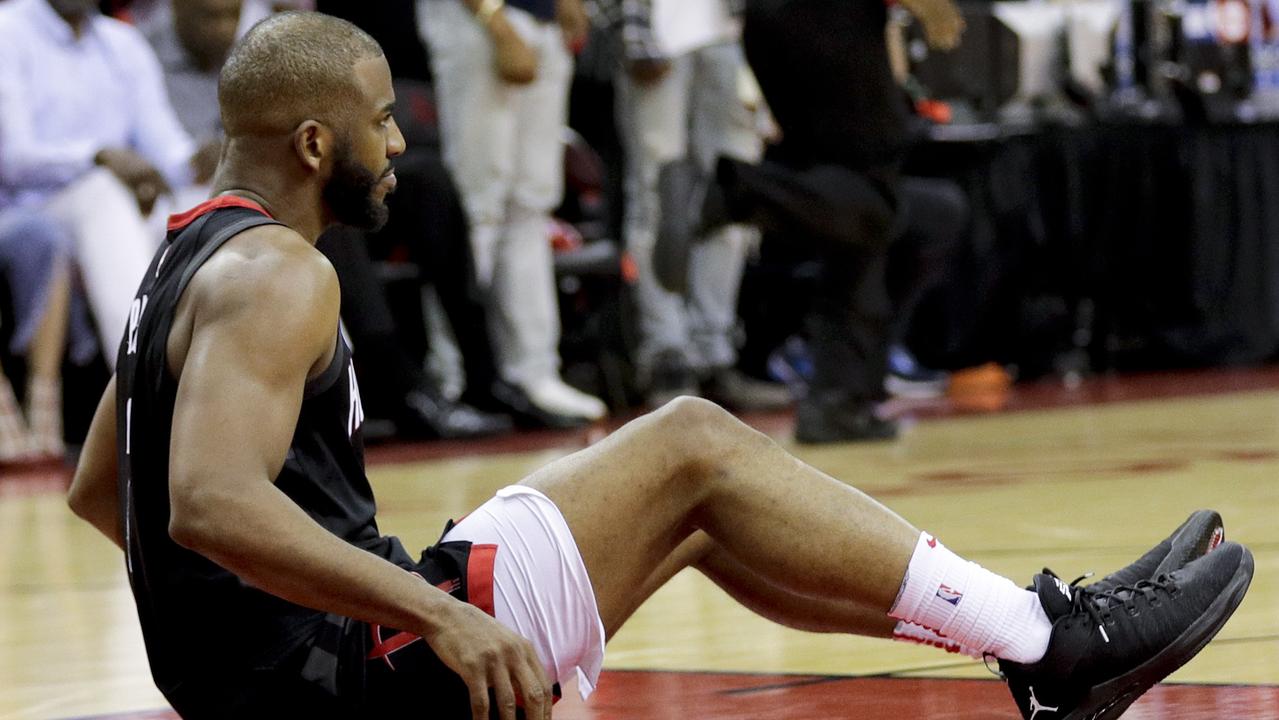 Houston Rockets guard Chris Paul sits on the floor after being hurt during the second half.