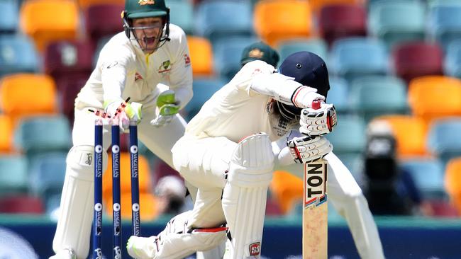 Tim Paine removes the bails to dismiss Moeen Ali on Sunday.