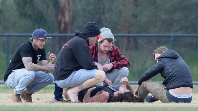 Devastated locals at the football club. Picture: Lawrence Pinder.