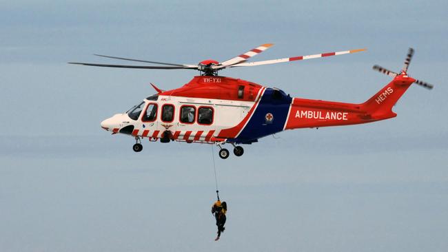 Two men were rescued from massive swell. Picture: Ian McCauley