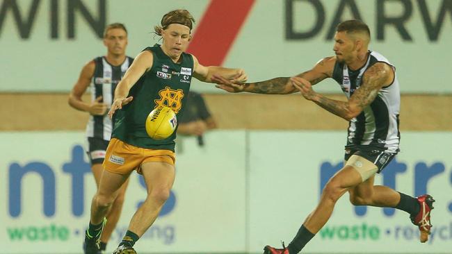 Palmerston’s Josiah Farrar goes in for a tackle against St Mary’s. Picture: Glenn Campbell