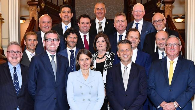 Parramatta MP Geoff Lee (TAFE) and Ryde MP Victor Dominello (Customer Service) with Premier Gladys Berejiklian’s other cabinet ministers this week after being sworn in at Government House. Picture: Joel Carrett