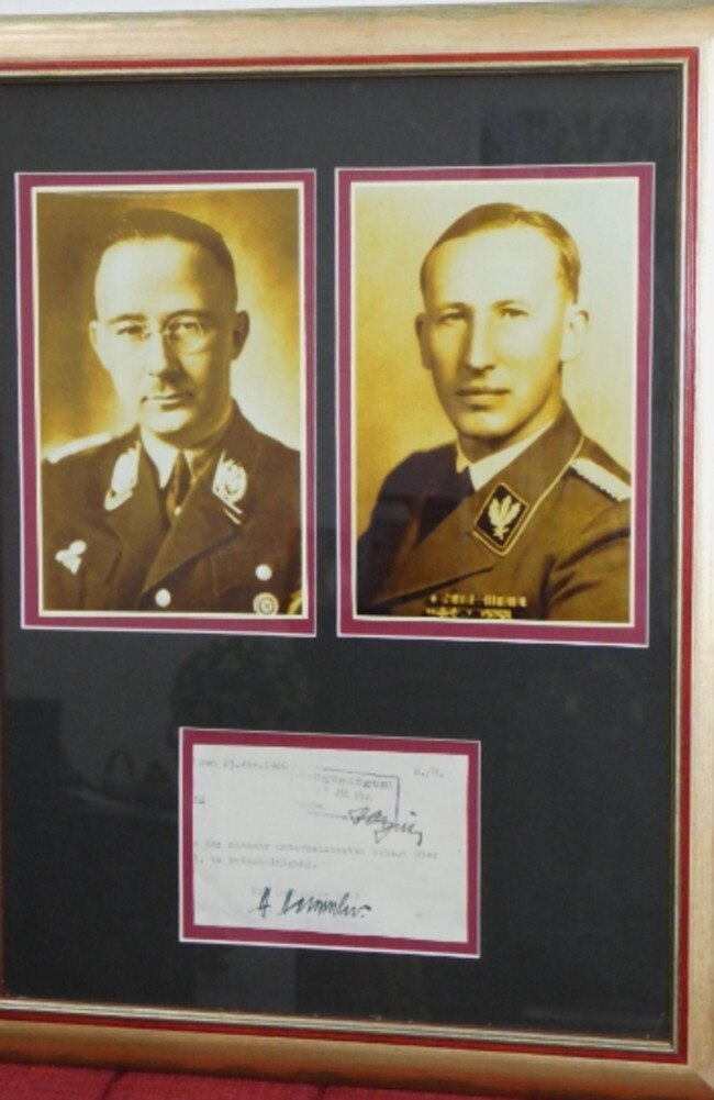 Signed portraits of Holocaust architects Heinrich Himmler and Reinhard Heydrich which is being auctioned on the Gold Coast.