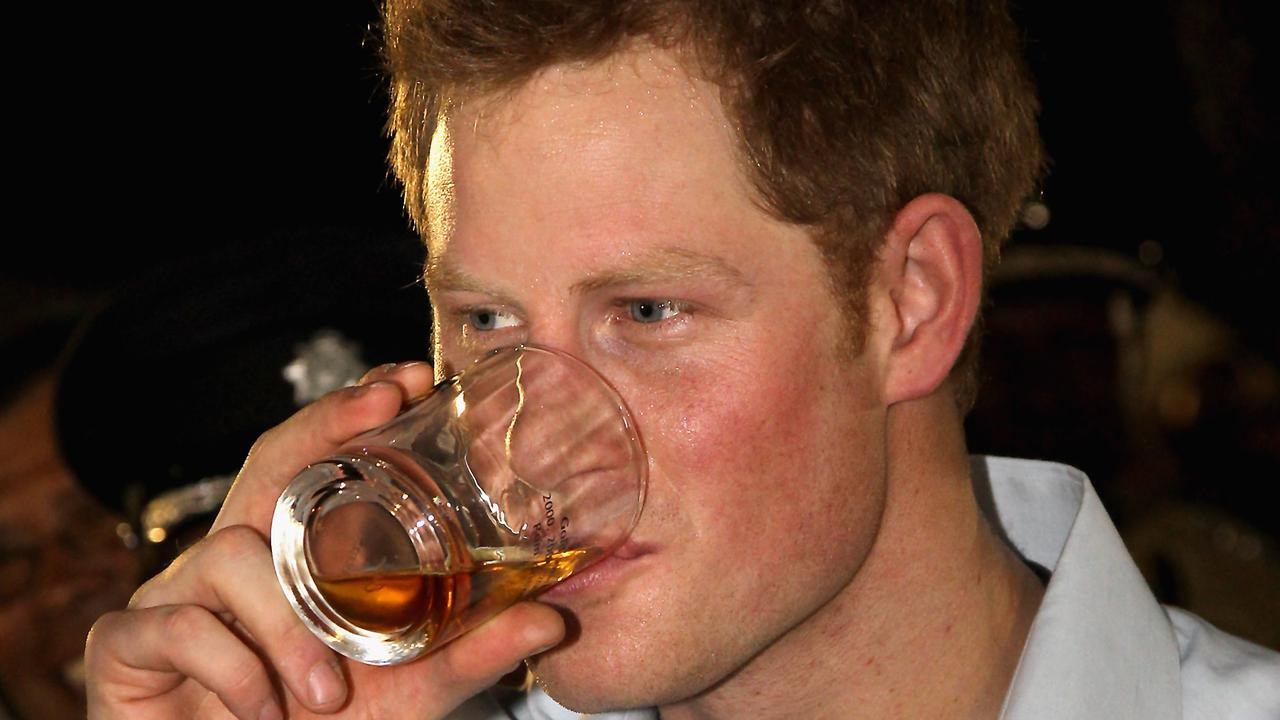 Prince Harry enjoys a drink in Belize. Picture: Getty