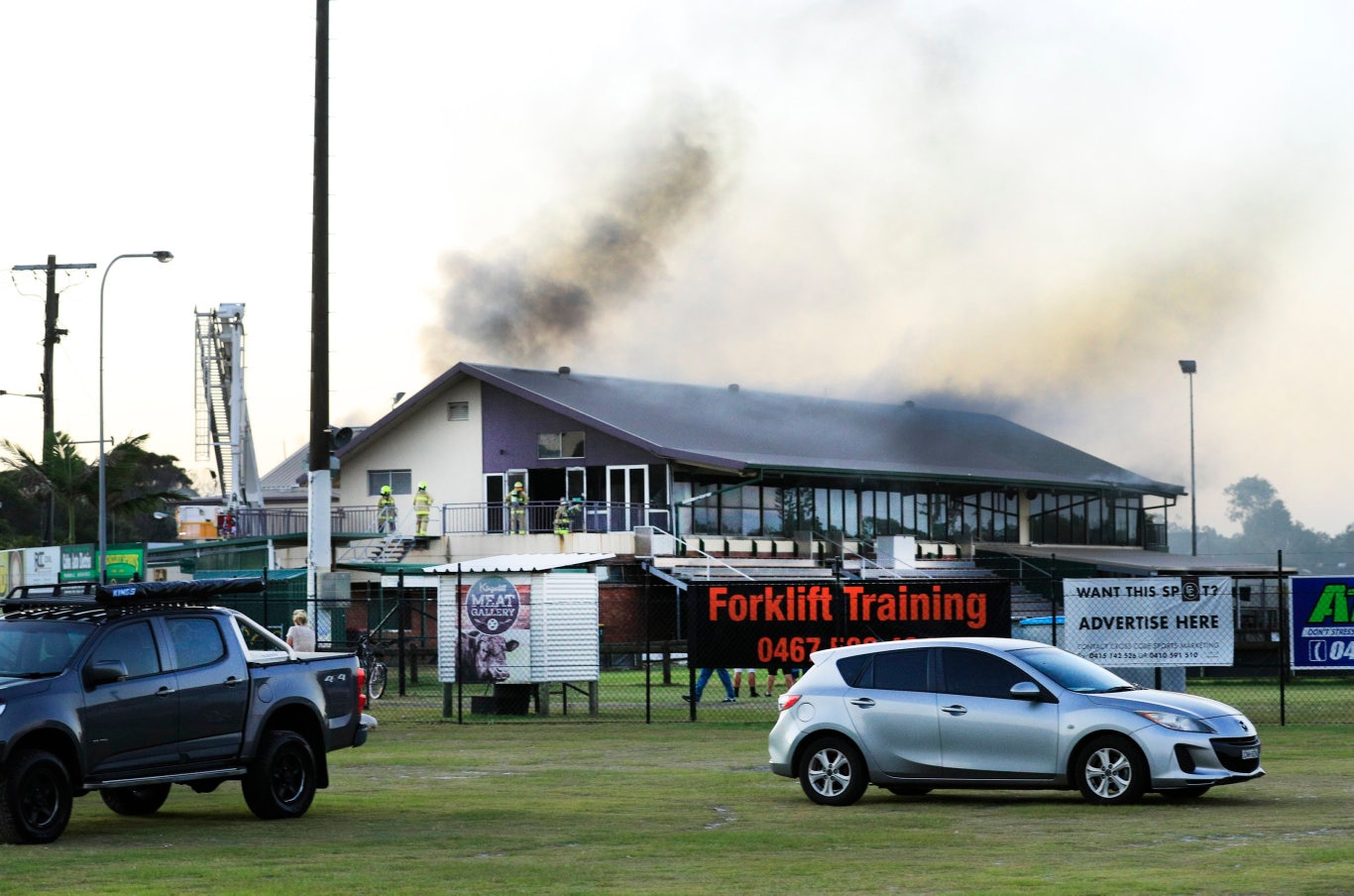 Thick black smoke bursts from the roof of the Cudgen Leagues club as Queensland Fire Brigade Officers assist local Kingscliff and Tweed Fire Units to fight the fire .Photo Scott Powick Newscorp