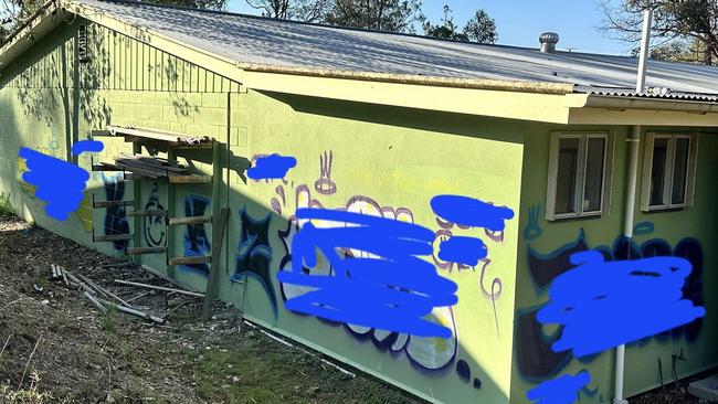 The damage and tagging the second time Gympie Scouts were hit by the vandal.