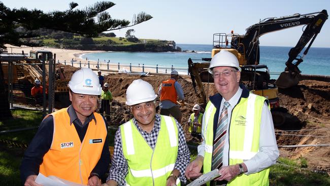 Eddie Dang, project manager for Cockram Construction, Randwick Mayor Noel D'Souza and council’s project manager John Brandon at the construction site on the lower promenade at Coogee Beach. Picture: Craig Wilson