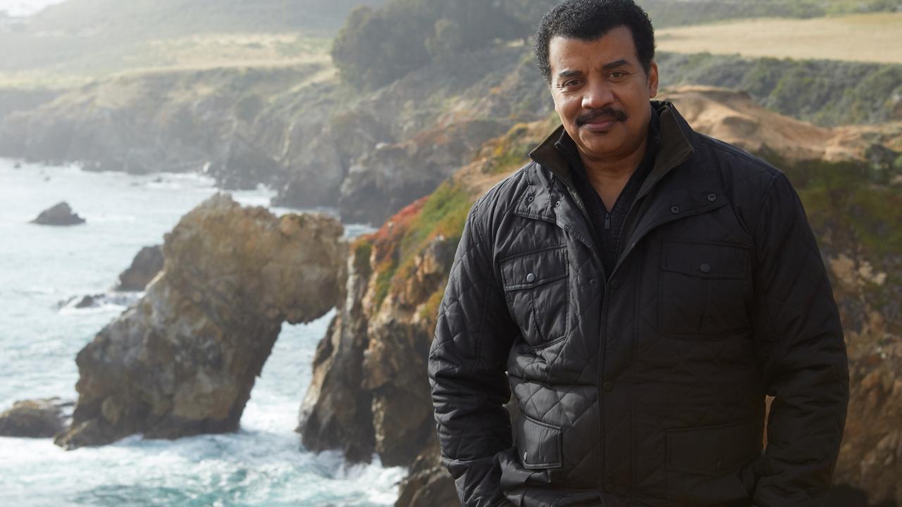 Host Neil deGrasse on the Monterey cliffs filming COSMOS: POSSIBLE WORLDS, which premieres March 9, 2020 on National Geographic. (Patrick McElhenney/FOX)