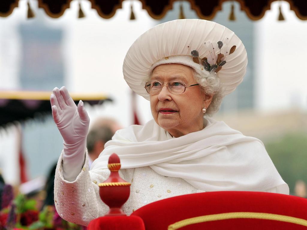 Hat, scarf and gloves — Britain's Queen Elizabeth II is also the queen of fashion in her own right. Picture: AP Photo/John Stillwell