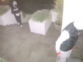 Four people, in hooded jackets and wearing gloves, were caught on a security camera trying to get inside a house at Clontarf about 1am to steal keys to a high-powered car. Picture: Still from suppled video