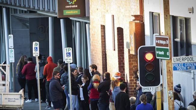 People line up outside the Centrelink office in Hobart. Picture: CHRIS KIDD