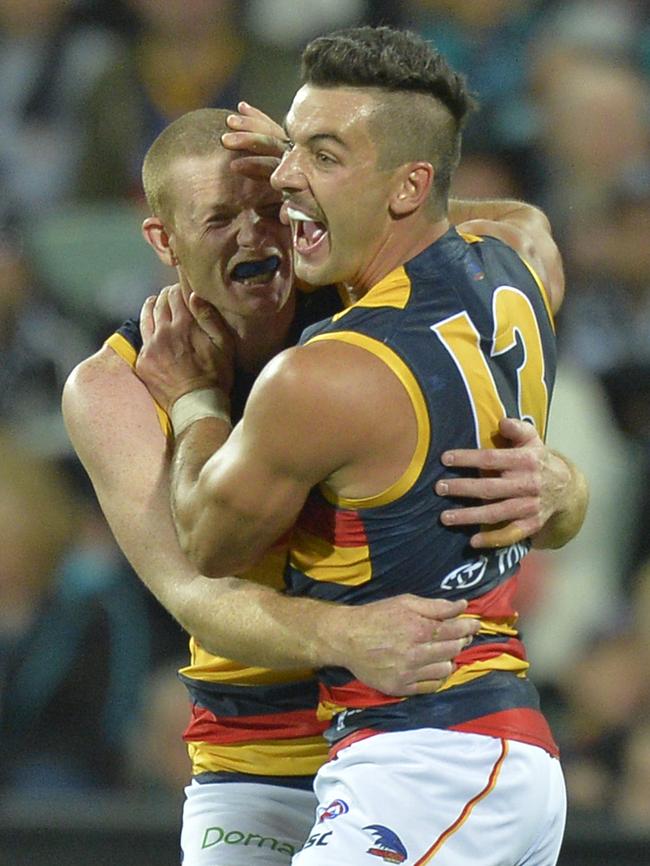 Taylor Walker and Sam Jacobs celebrate a goal during the 2017 Showdown.