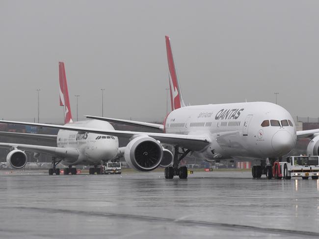 The new QANTAS Boeing 787 Dreamliner aircraft is followed by an A380 Airbus as it arrives on its first flight into Sydney, Friday, October, 20, 2017.  (AAP Image/Dean Lewins) NO ARCHIVING