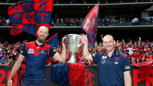 Max Gawn and Simon Goodwin keep that cup firmly aloft for their adoring fans. Picture: AFL Photos via Getty Images