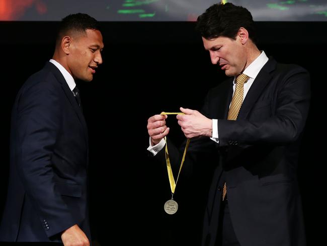 Wallabies great John Eales presents Israel Folau with the John Eales Medal in Sydney on Thursday night.