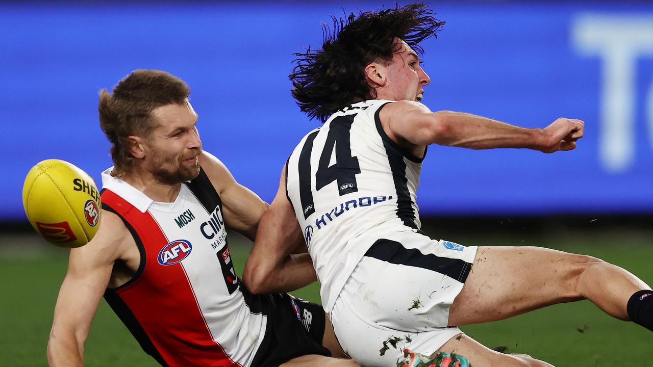 The Saints were adamant that this tackle should have resulted in a free kick, but replay showed Hollands did get a handball away. Photo by Michael Klein.