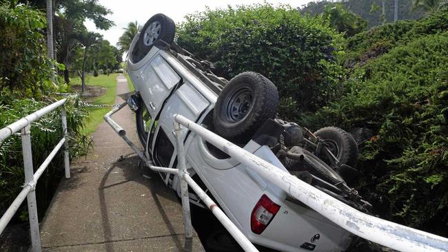 A pedestrian walkway has been cordoned off after the rails were damaged in a single car rollover on Shute Harbour Rd at Cannonvale this morning. Picture: Claudia Alp