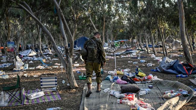 An Israeli soldier on patrol near Kibbutz Beeri, the place where 270 revellers were killed by militants during the Supernova music festival.