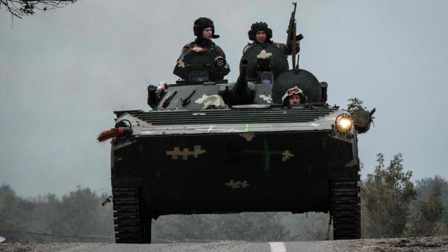 Ukrainian soldiers in an armoured personnel carrier. Picture: AFP