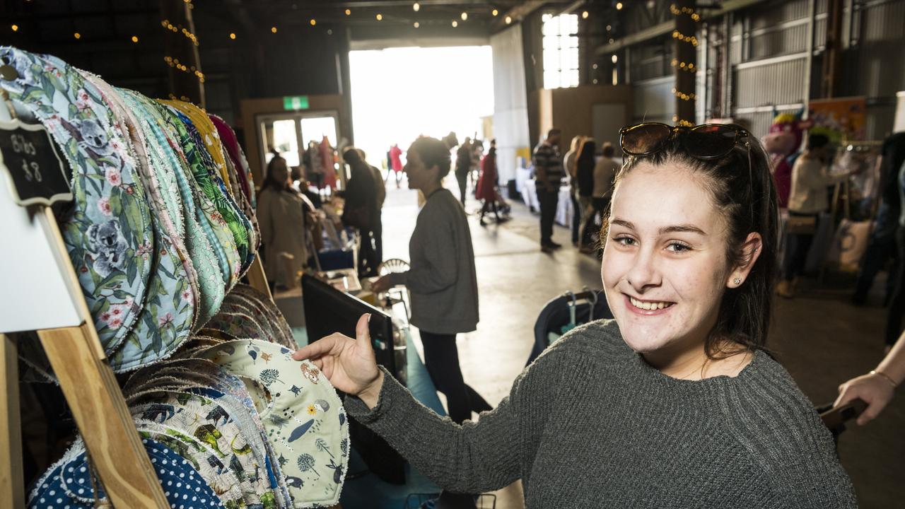 BROWSING BIBS: Jessica Norman buys a bib from Baby Ellie Designs at the Mums and Bubs Expo. Picture: Kevin Farmer