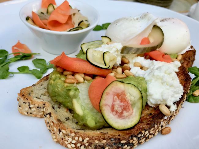 Smashed avocado with fetta, house pickles, poached egg and toast. Picture: Jenifer Jagielski