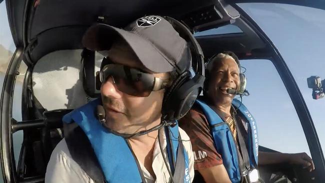 Troy Thomas flying with Ernie Dingo while filming Going Places.