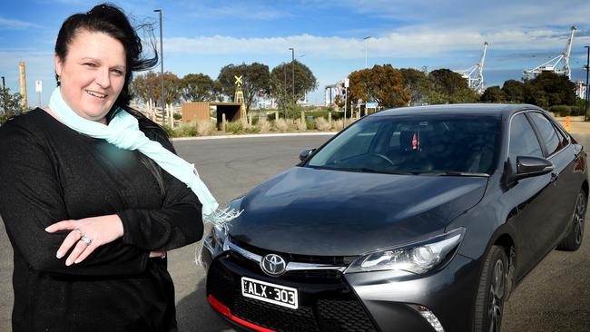 Uber driver Melanie Evans McInroy with her car. Picture: Nicole Garmston