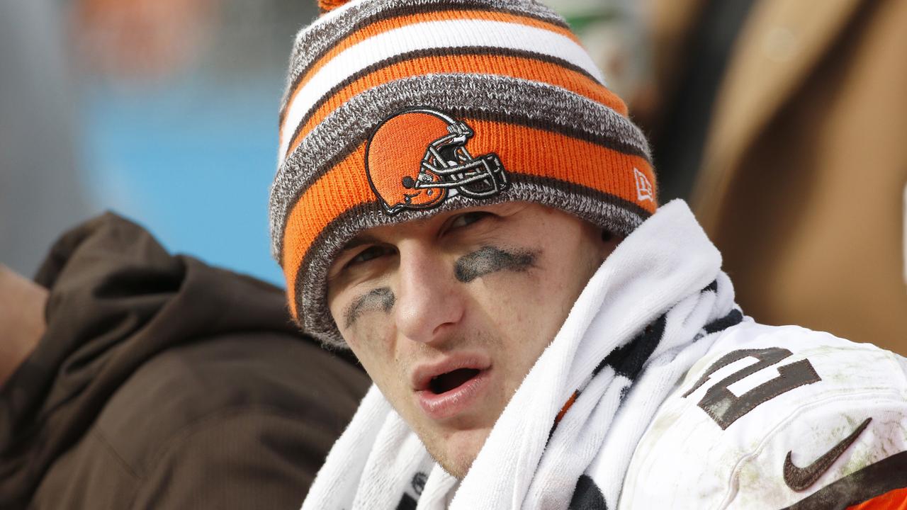 FILE - In this Sunday, Dec. 21, 2014, file photo, Cleveland Browns quarterback Johnny Manziel (2) sits on the bench during the second half of an NFL football game against the Carolina Panthers in Charlotte, N.C. An advisor for Manziel said in a statement released by the team Monday, Feb. 2, 2015, that Manziel has decided to enter treatment for an unspecified condition. (AP Photo/Bob Leverone, File)