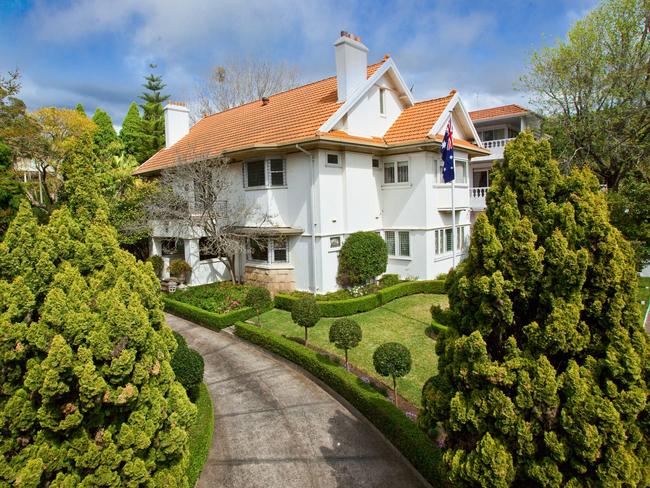 It is surrounded by landscaped lawns and gardens.