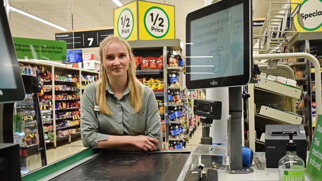 Woolworths employee Patrice Hughes has maintained a smile through the difficult times in recent months.