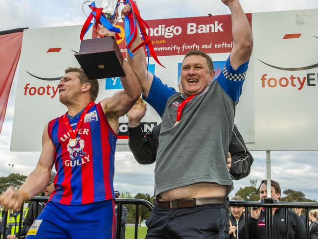 EFL Football (Division 3) grand final: Upper FTG v Templestowe. UFG captain Tim Riseley with coach Chad Rogers lifting the cup. Picture: Valeriu Campan