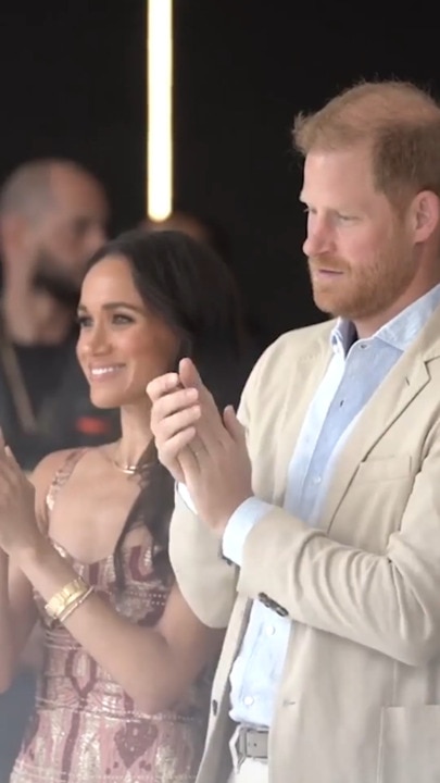 Harry and Meghan show off charity work as scathing new doco airs