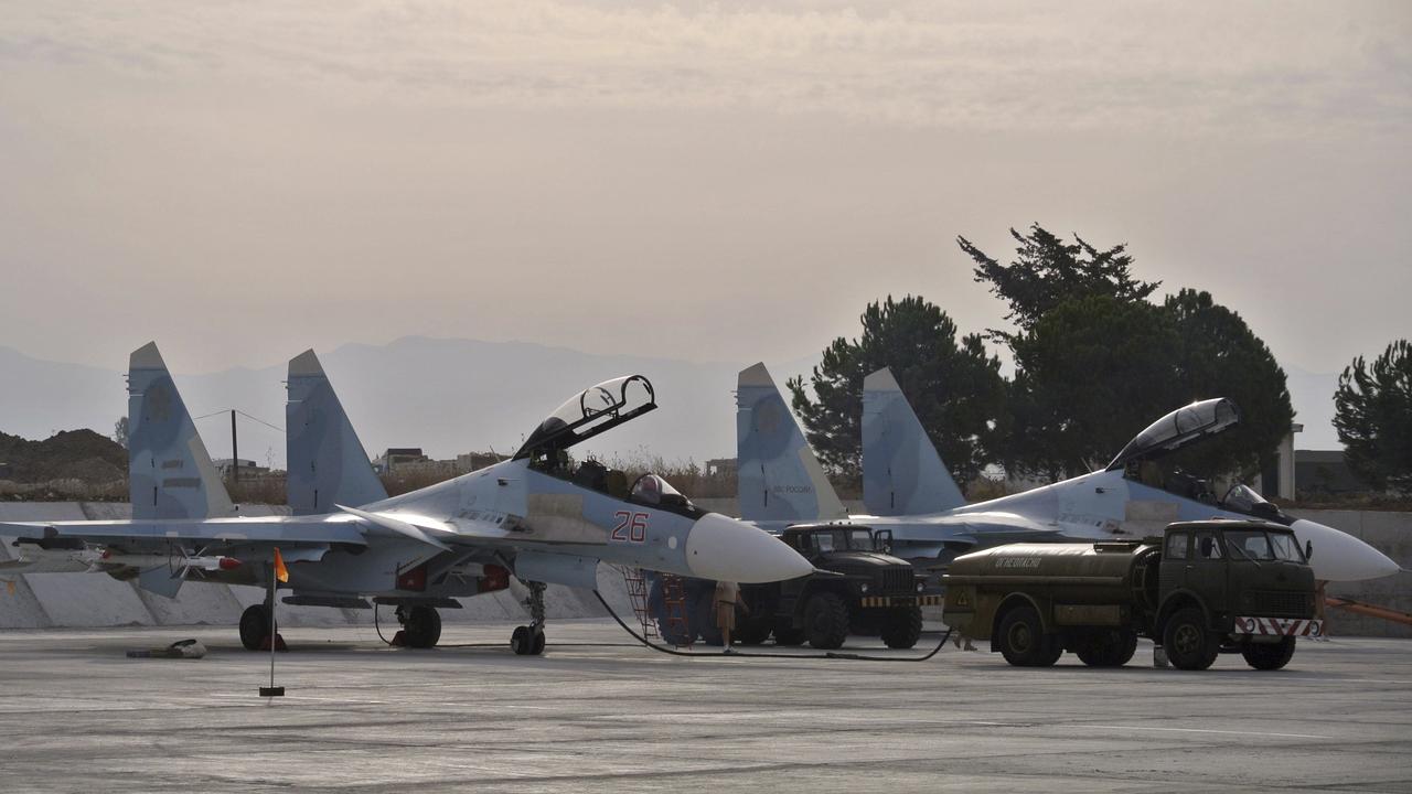 Russian fighter jets are parked in preparation for combat action at Hemeimeem airbase, Syria. Picture: AP