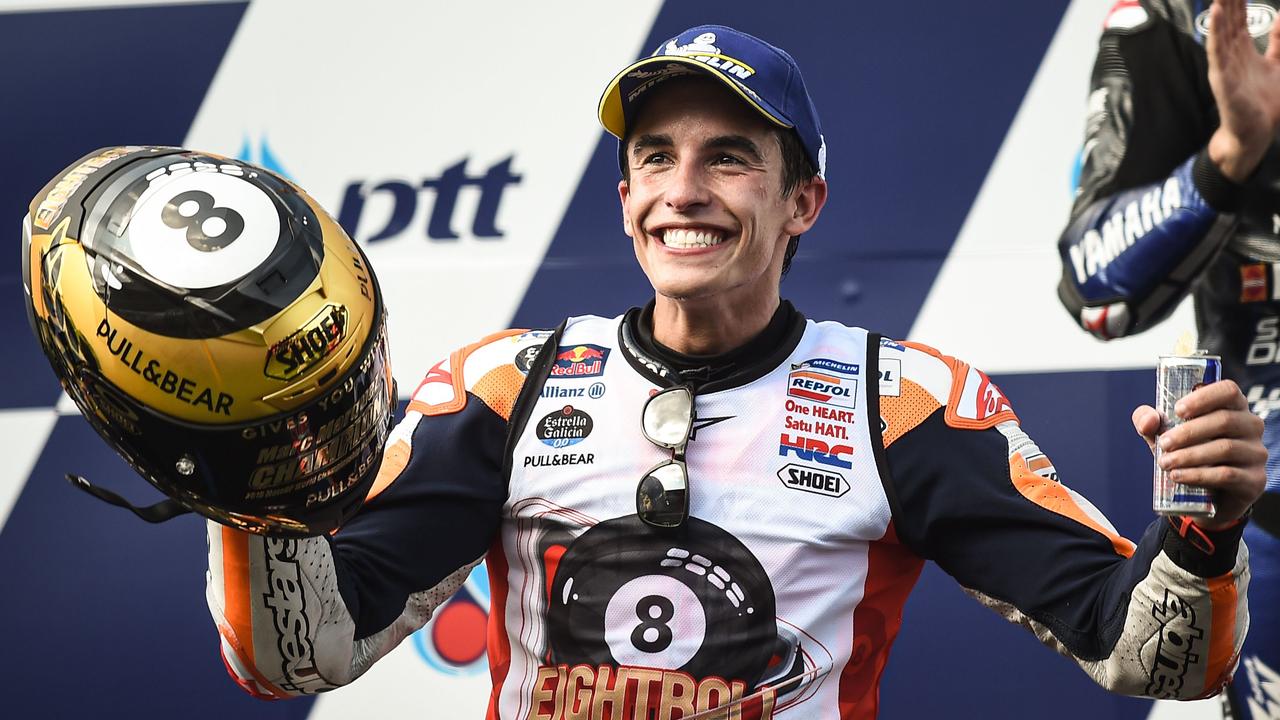 Marc Marquez celebrates on the podium in Buriram. Picture: Lillian Suwanrumpha