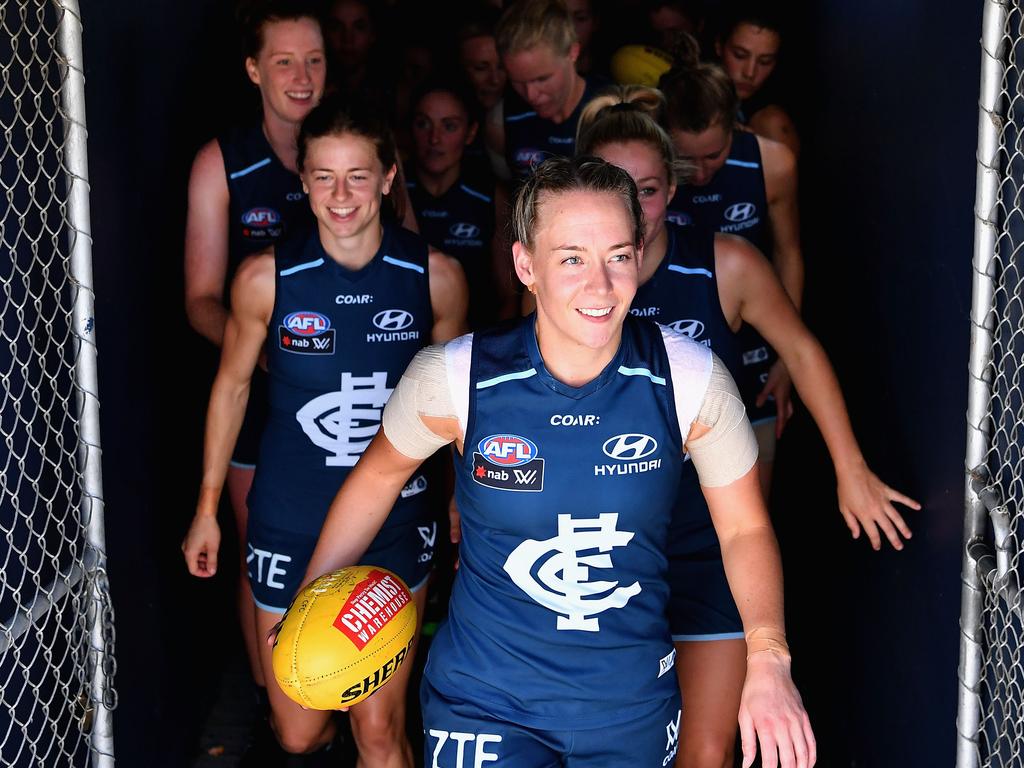 Lauren Arnell leads Carlton onto Ikon Park in 2017, the inaugural year of the AFLW. Picture: Quinn Rooney/Getty Images