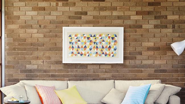 Make sure you have permission first before putting hooks in the wall for pictures.