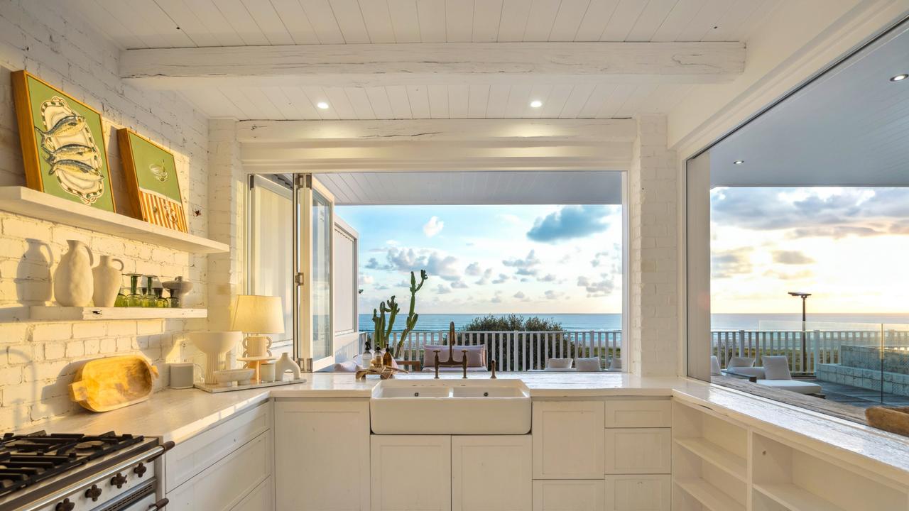 The property includes a five-bedroom residence and separate self-contained double-storey cottage