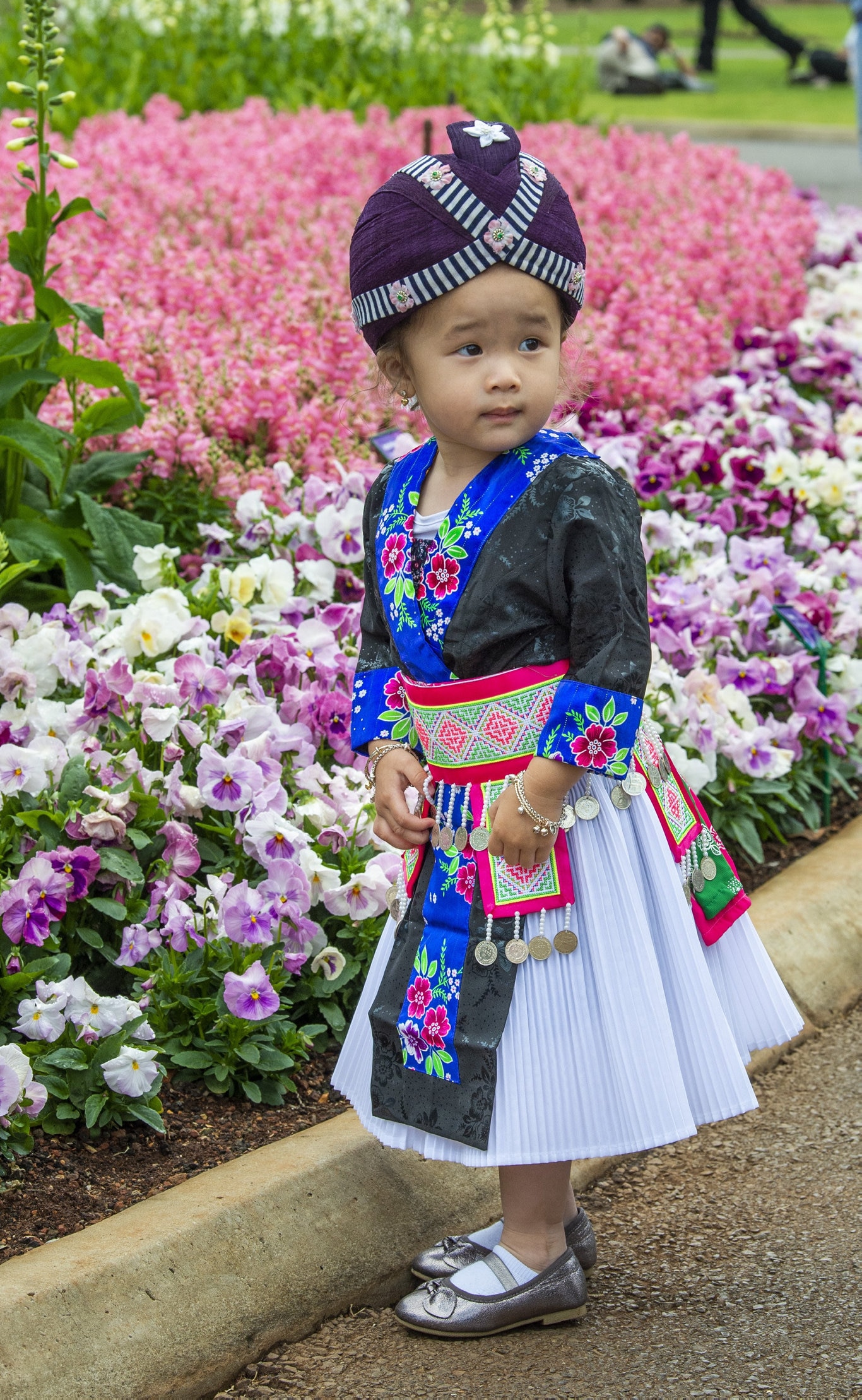 Two year old Chee Lee wears traditional Hmong dress