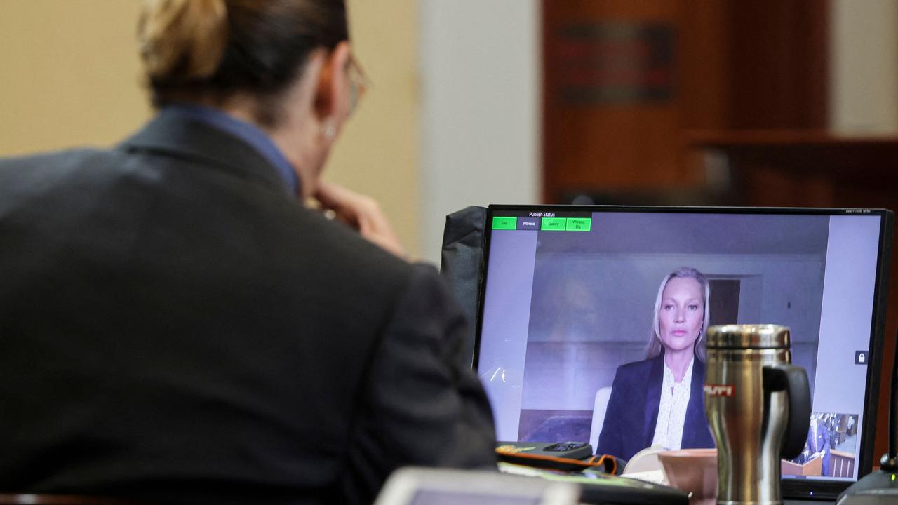 Johnny Depp listens as his former girlfriend Kate Moss, testifies via video link. (Photo by EVELYN HOCKSTEIN / POOL / AFP)