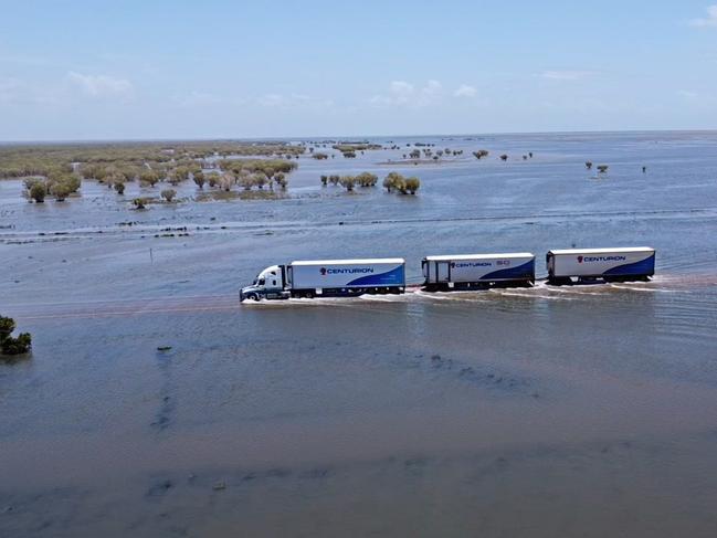 A road train drives through flood waters in Roebuck Plains in the Kimberley region in January this year. Picture: Eddy Dolic - Centurion Transport