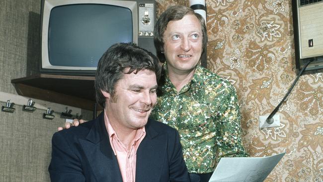 Comedy writer Mike McColl Jones goes over a script with Graham Kennedy, in his backstage dressing room.