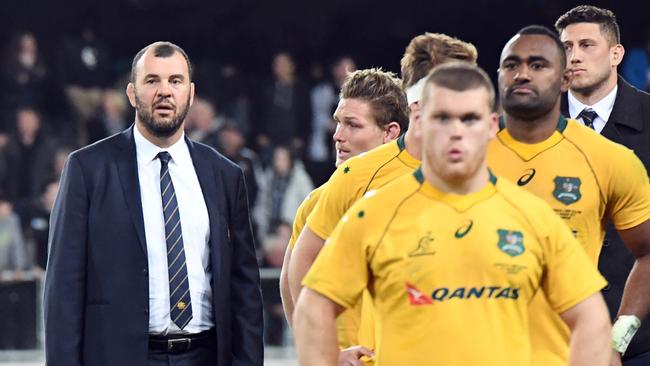 Michael Cheika, left, coach of Australia, after his teams defeat to New Zealand. Picture: AAP