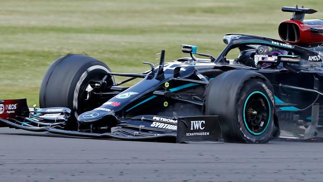 The punctured tyre of Mercedes' British driver Lewis Hamilton punctures is pictured as he goes on to win the Formula One British Grand Prix at the Silverstone motor racing circuit in Silverstone, central England on August 2, 2020. - Lewis Hamilton survived a dramatic finale to win the British Grand Prix on Sunday, just making it across the line on three tyres to beat a fast closing Max Verstappen on Red Bull. The defending world champion claimed his seventh British Grand Prix win as Ferarri's Charles Leclerc came third and Daniel Ricciardo of Renault fourth. (Photo by ANDREW BOYERS / POOL / AFP)