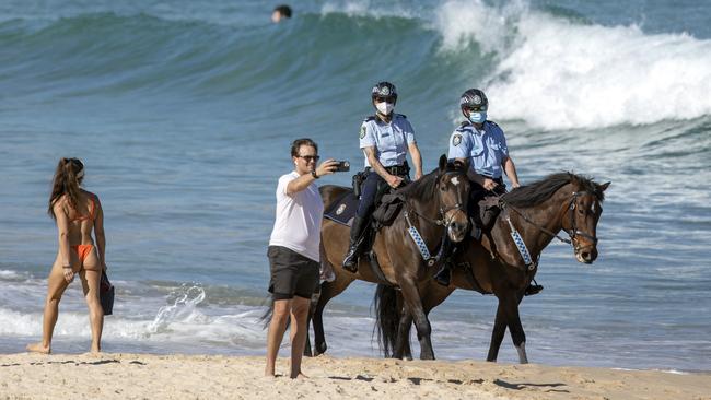 Mounted police at Bondi Beach on Monday as NSW police ramp up patrols and compliance measures to enforce the state’s tough new lockdown rules. Picture: Liam Mendes