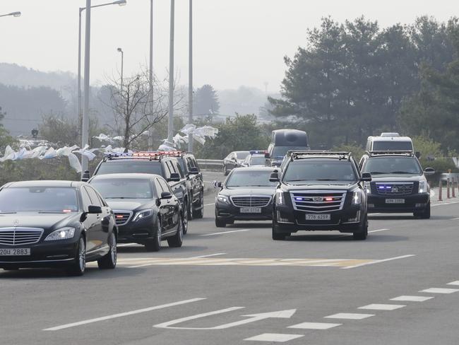 A motorcade carrying South Korean President Moon Jae-in arrives at the Unification Bridge, which leads to the Panmunjom in the Demilitarised Zone, in Paju. Picture: Lee Jin-man/AP