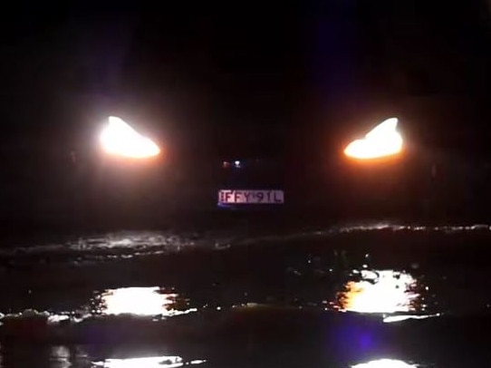 Footage has captured the moment a Tesla became trapped in floodwaters in Port Macquarie, as wild weather conditions batter the region. Picture: Adam Dederer
